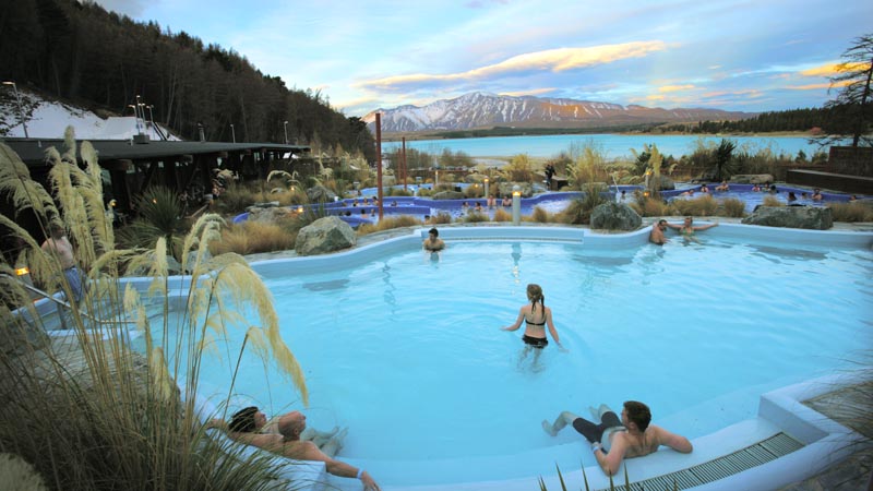 Relax in the stunning hot pools at Tekapo Springs, overlooking the Lake and Two Thumb Mountain range.